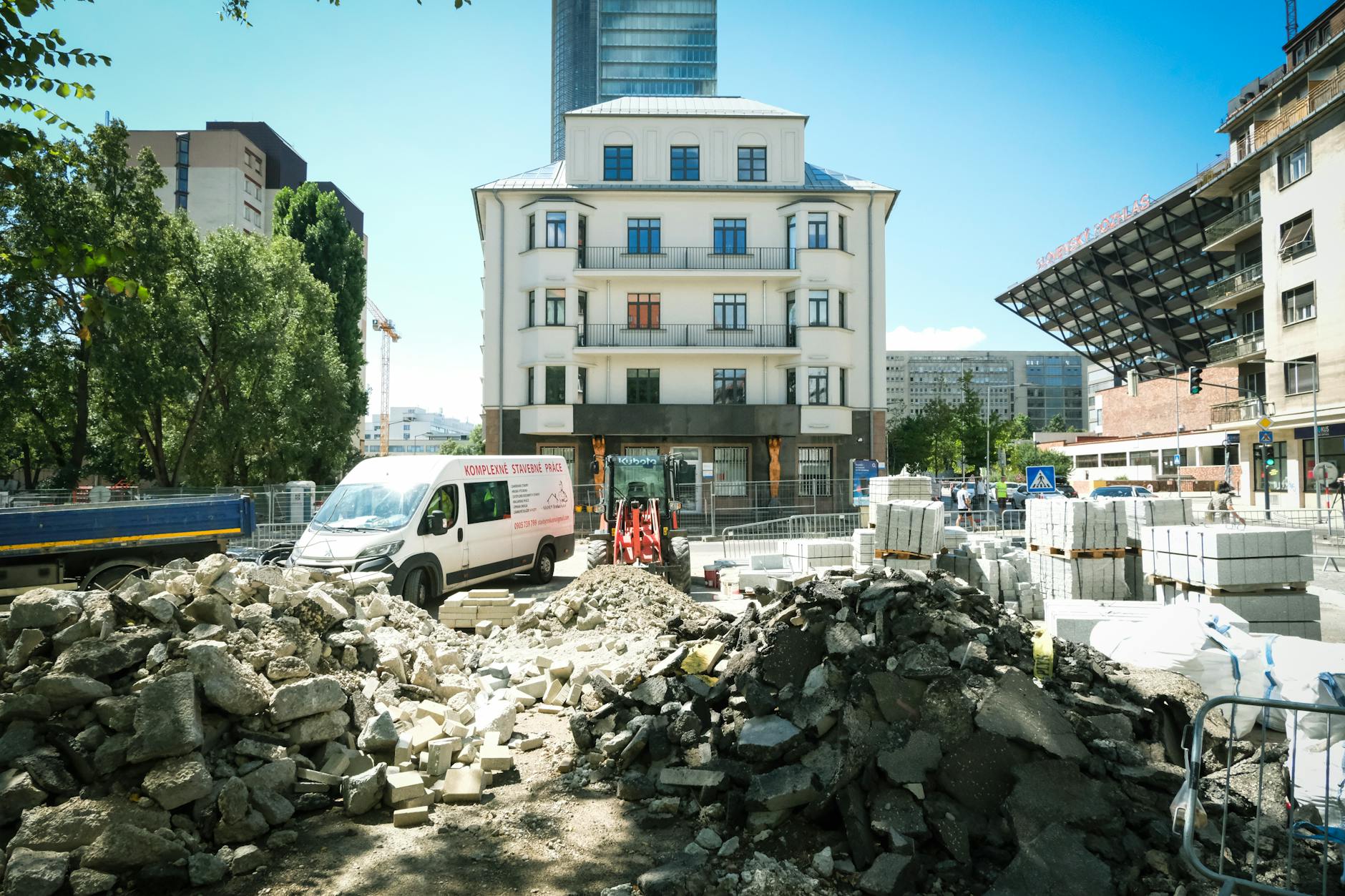 City center road construction site in Bratislava under bright daylight.