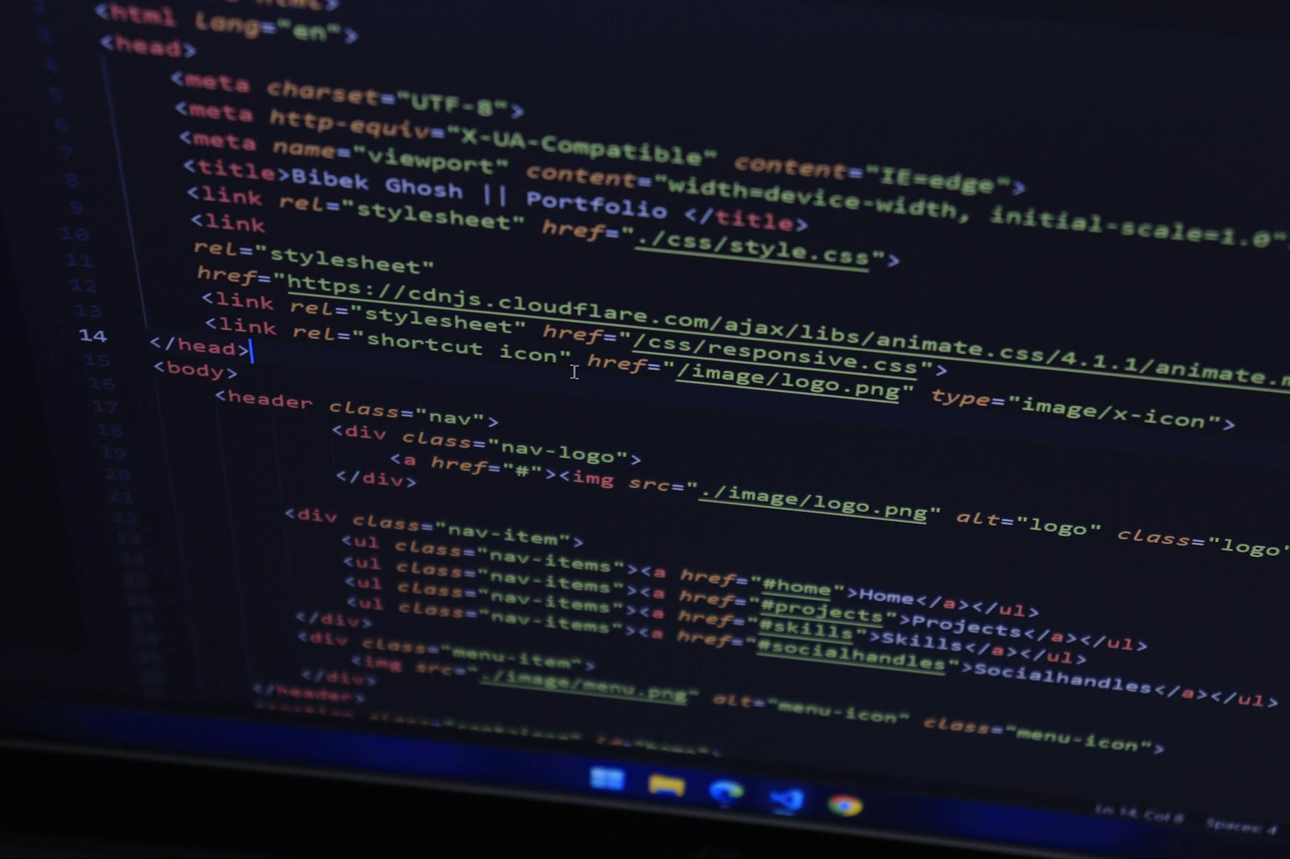 High-resolution close-up of HTML code displayed on a computer screen, perfect for technology themes.