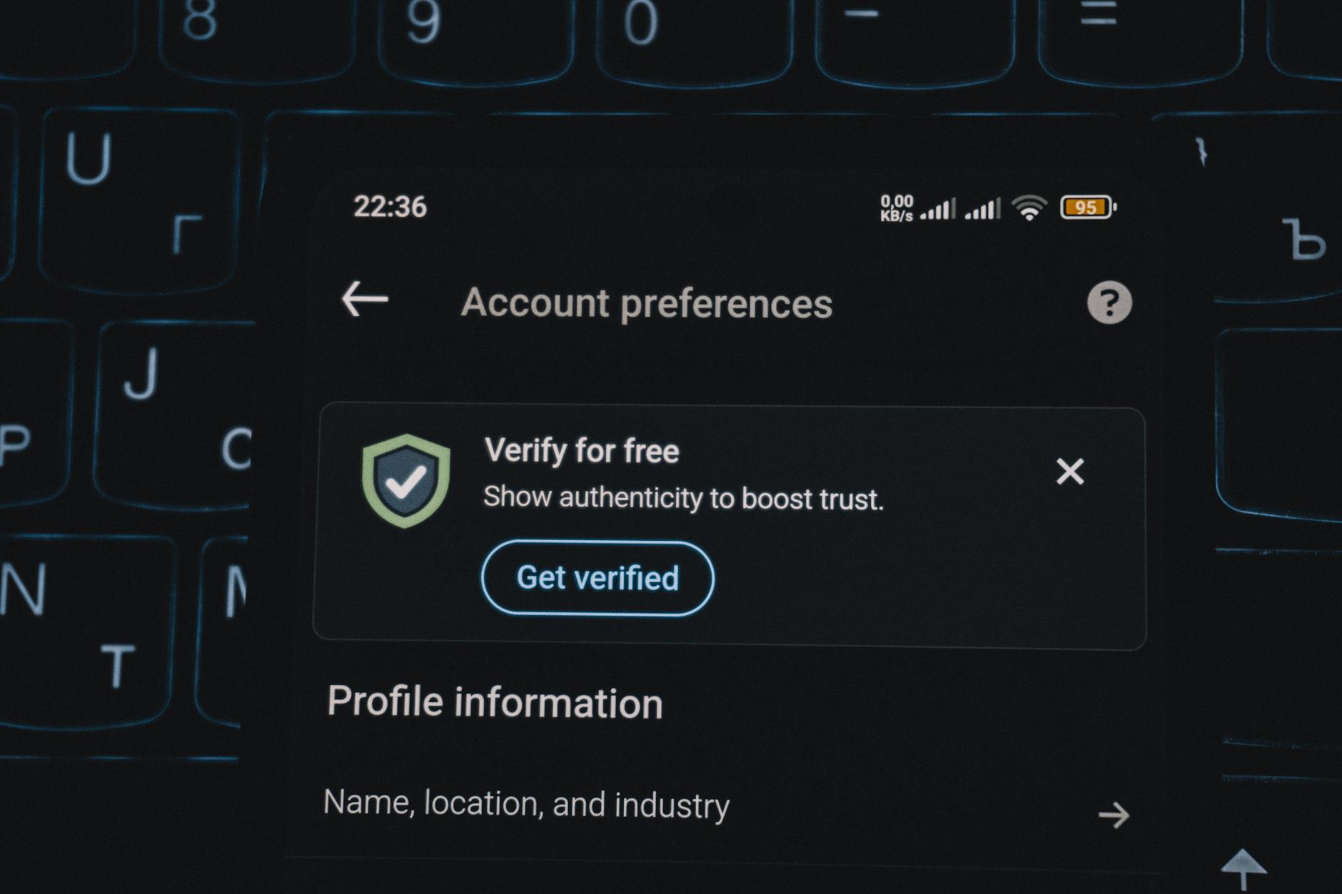 Close-up of a smartphone screen displaying account verification alert. Ideal for security and authenticity themes.