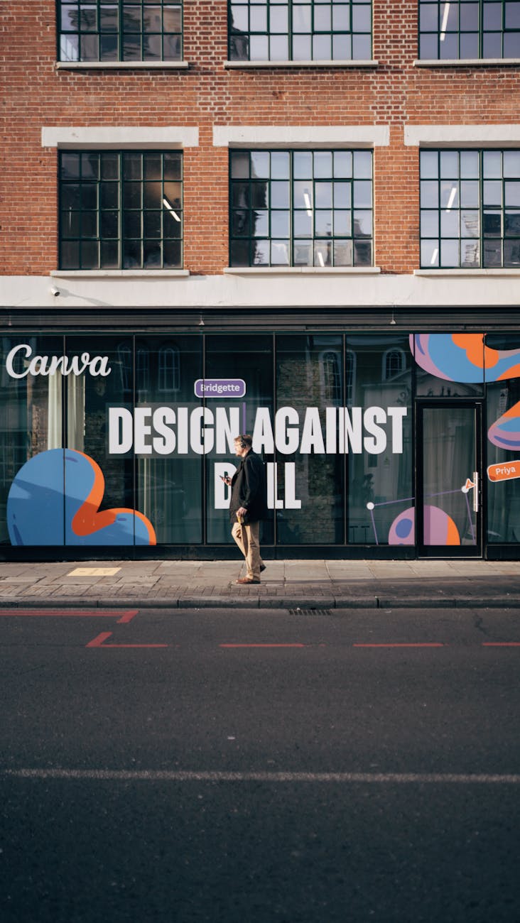 Person walking along a creative workspace exterior with bold design.